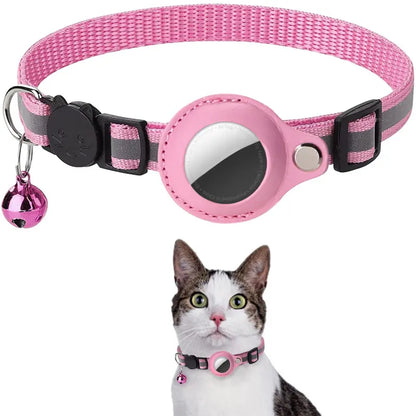 Pink striped cat collar with a bell and reflective patch, worn by a cat.