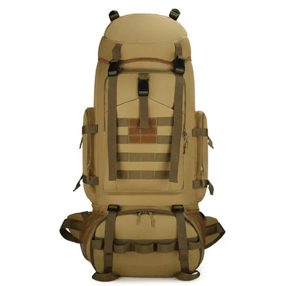 Tan backpack with multiple straps and compartments on a white background